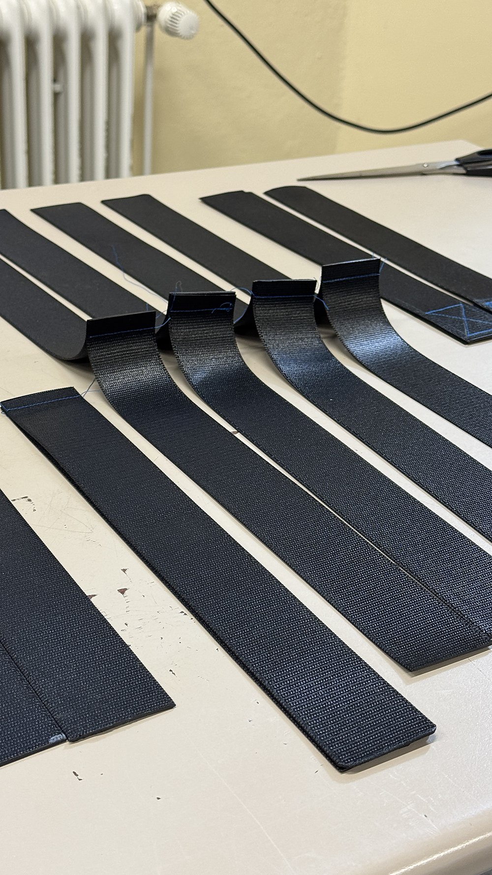 Cut seat-belt coupons laid out for testing