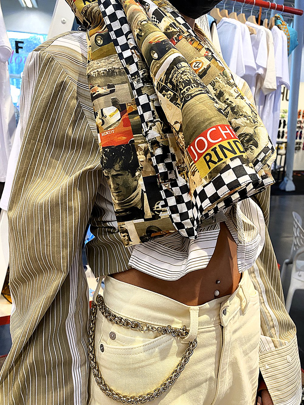 Styled look on the floor — printed scarf over a pinstripe shirt