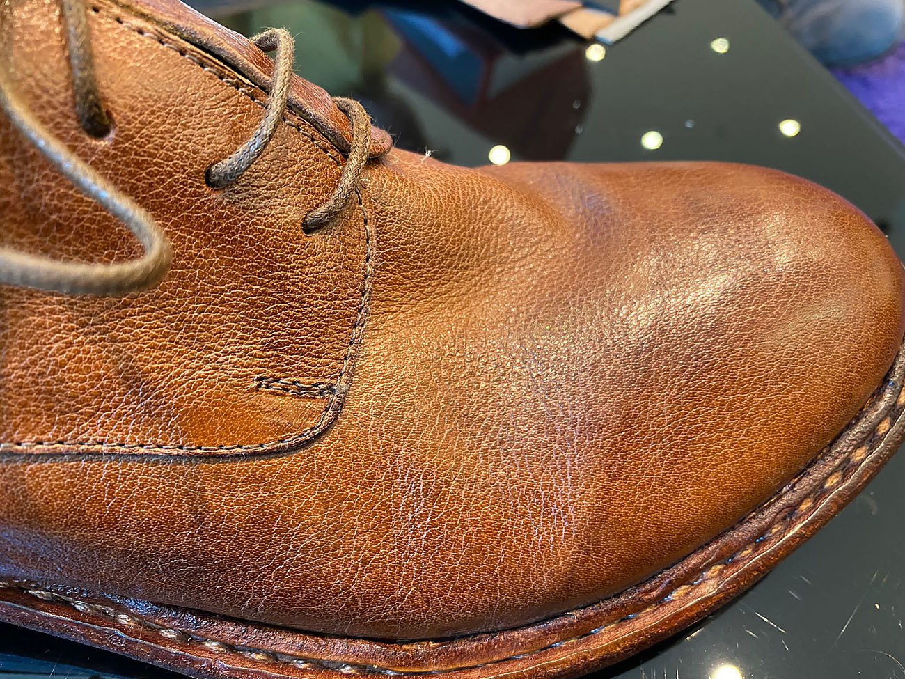 Tan leather boot, close on the welt and grain