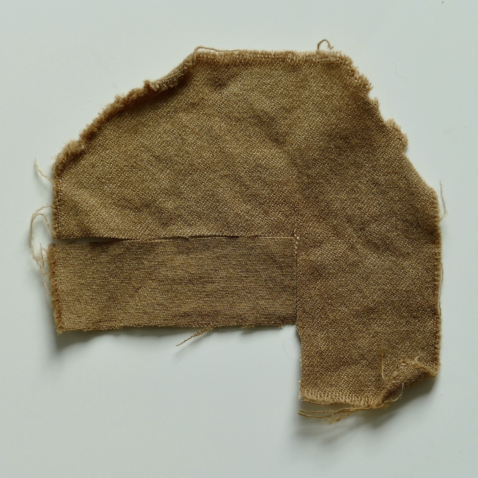 Wool dyed with pomegranate after alum and iron sulphate — olive brown