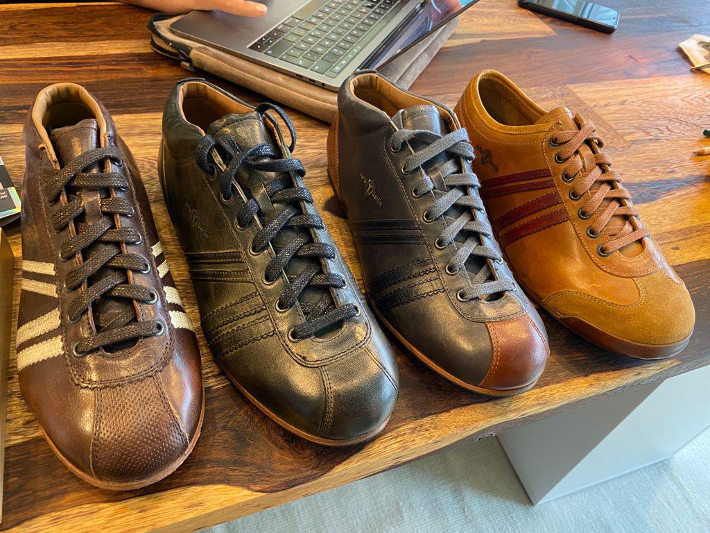 Four sample shoes lined up for comparison