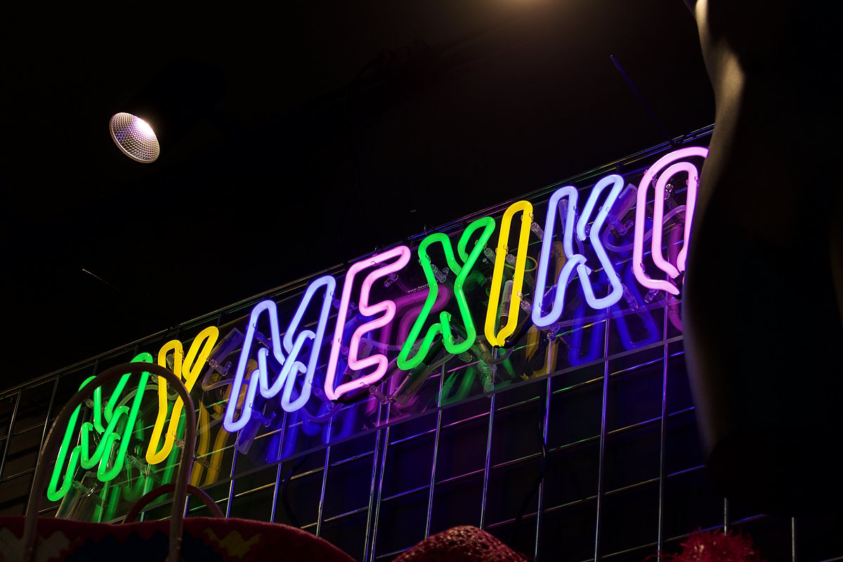 The MyMexiko neon sign on the grid wall